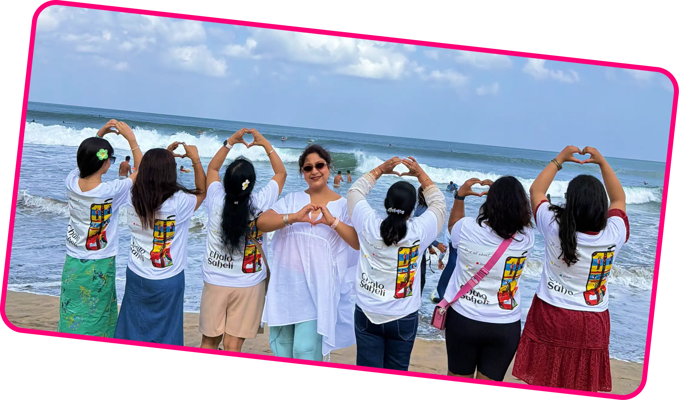 Chalo Saheli travelers making heart signs on the beach